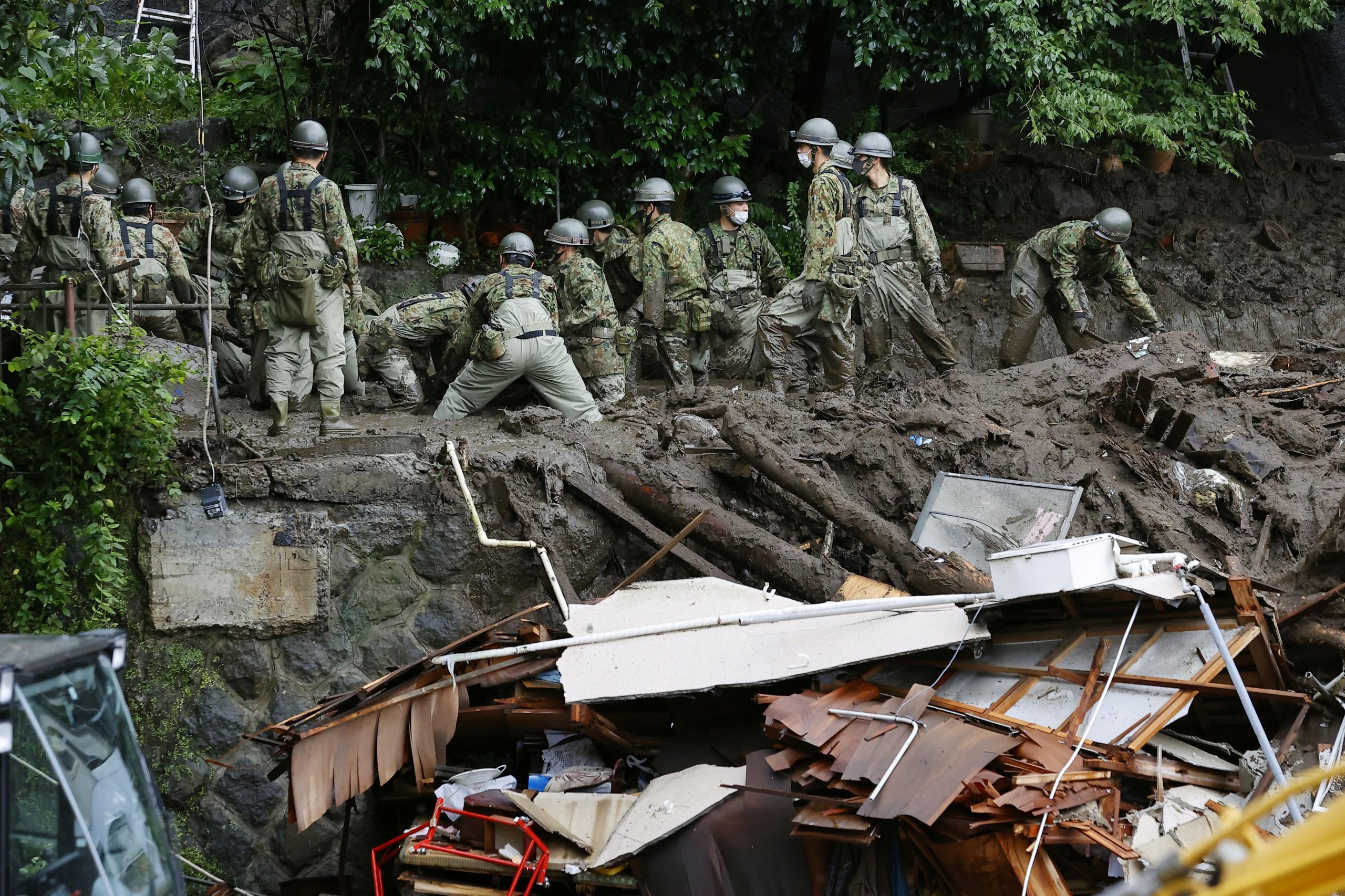 Rescuers in Japan Hunt for 80 missing After Deadly Landslides