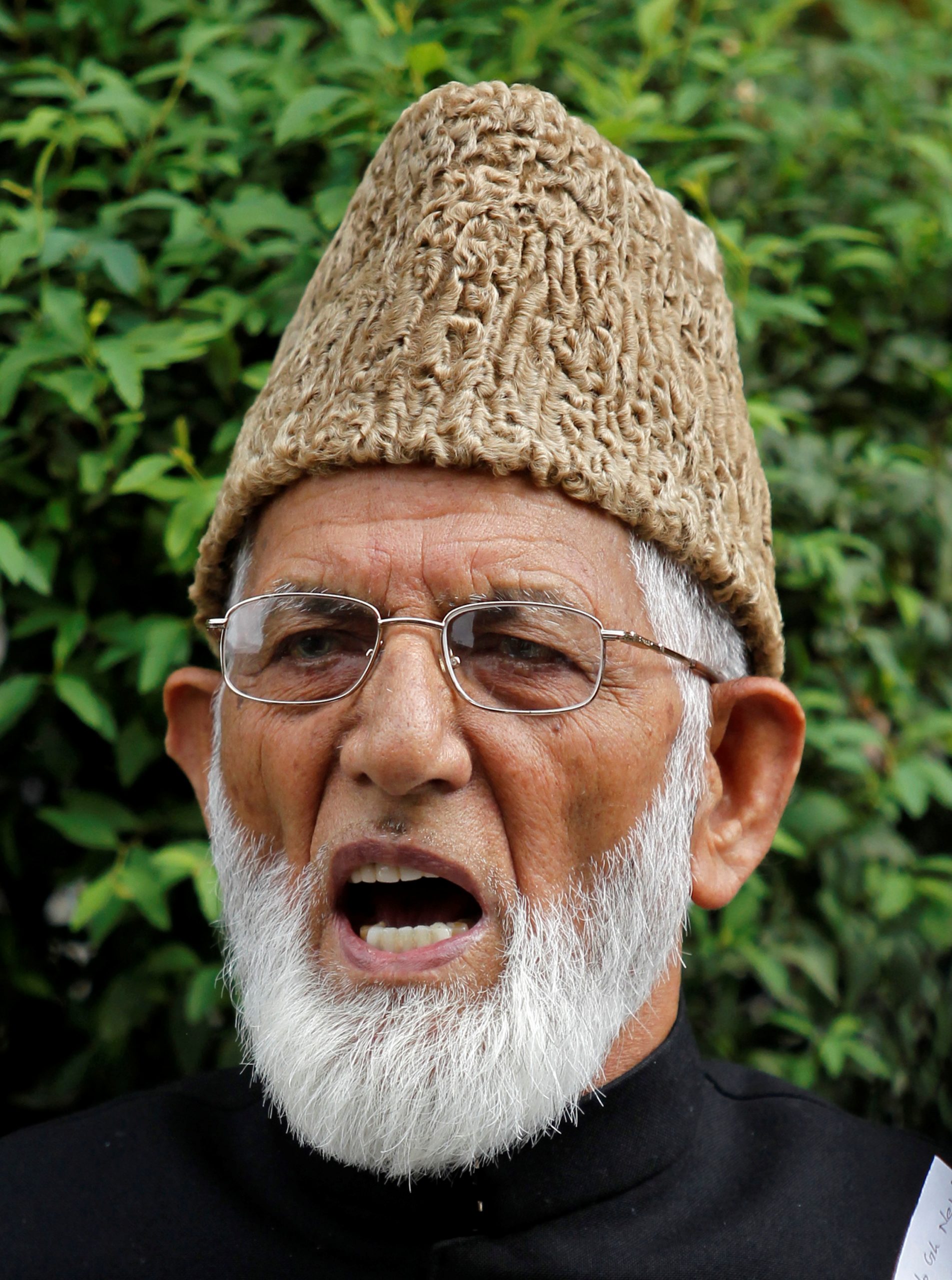 India locks down restive Kashmir after burial of separatist leader