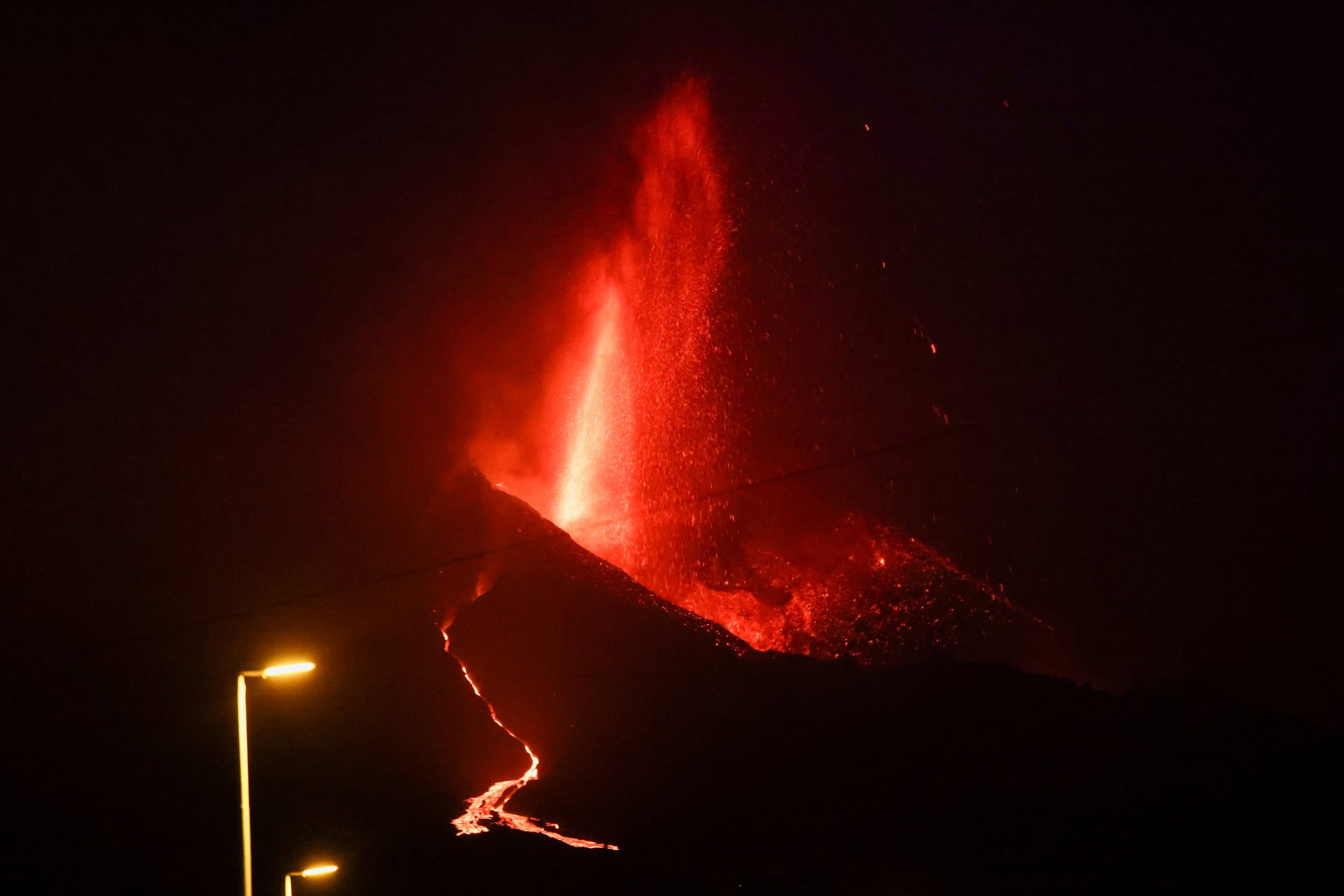 La Palma volcano spurts again as lava nears the sea