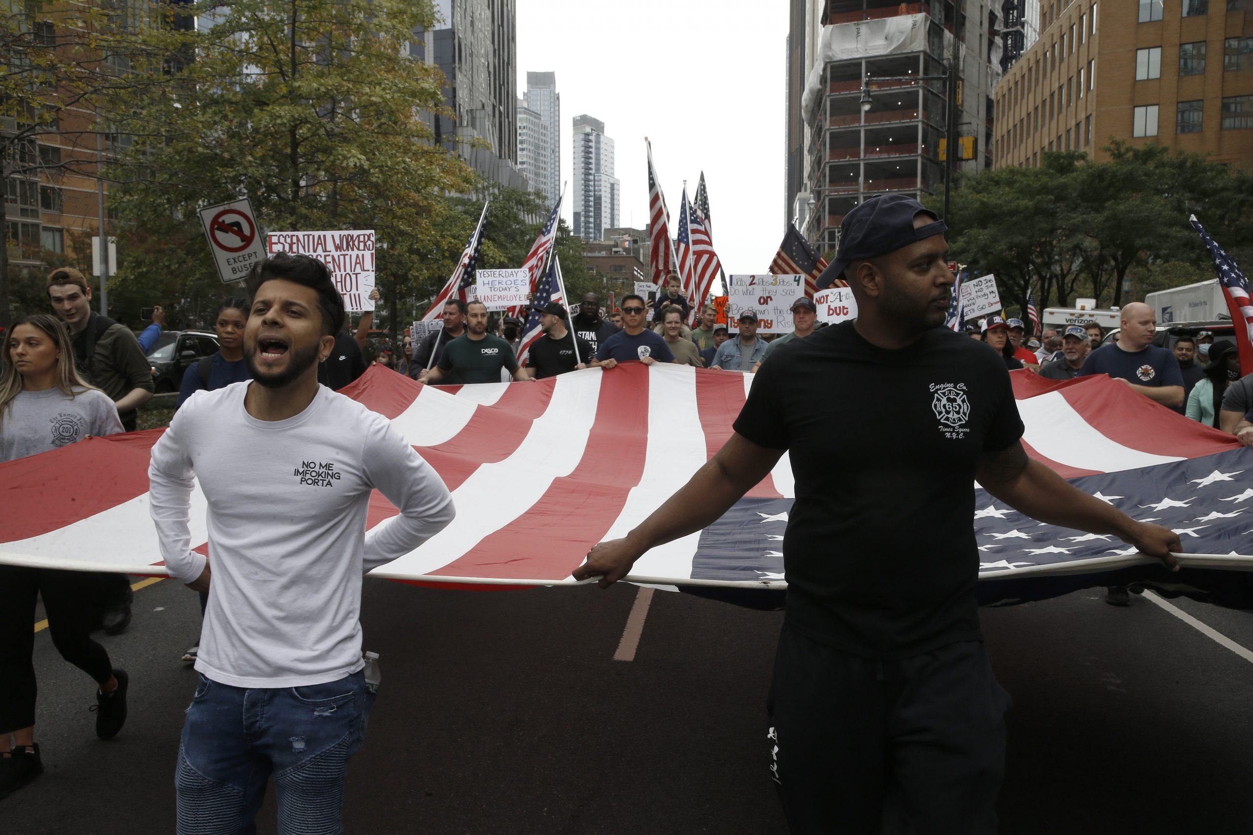 Thousands of city workers march on Brooklyn Bridge to protest vax mandate