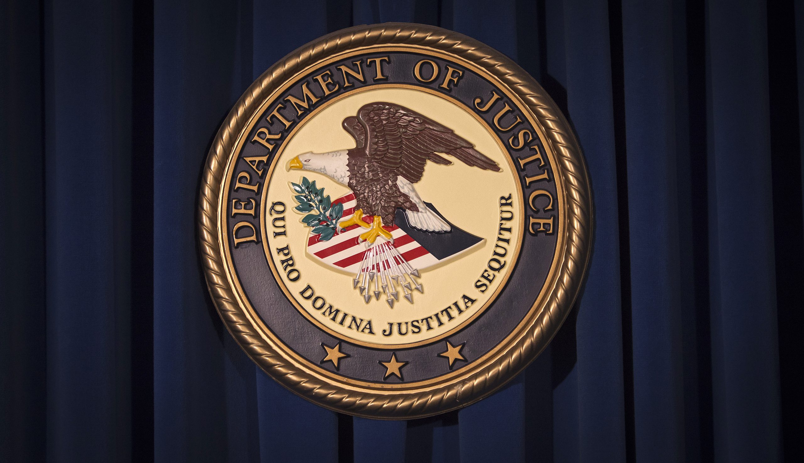 DOJ files suit to block merger between publishing giants