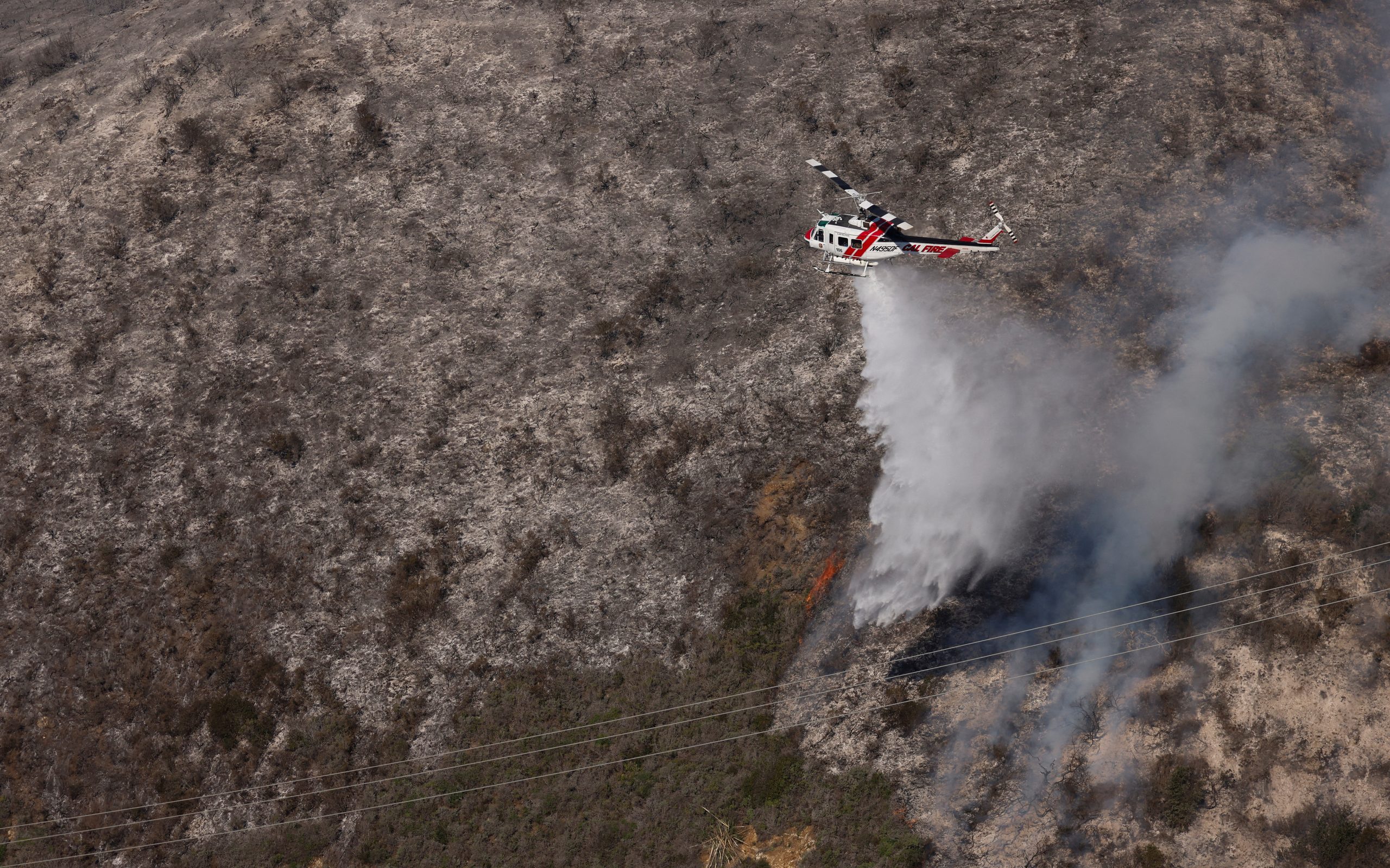 Firefighters gaining control of wildfire that closed scenic California highway