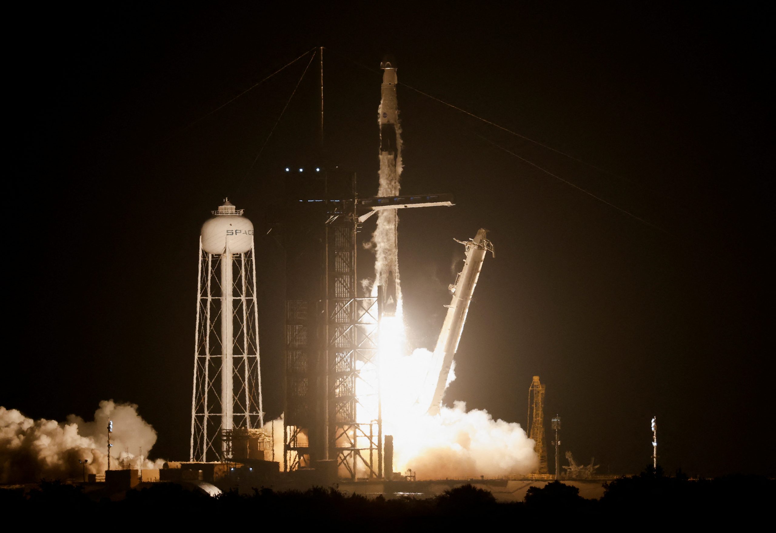 Textbook launch as Musk’s SpaceX sends 4 astronauts to space station