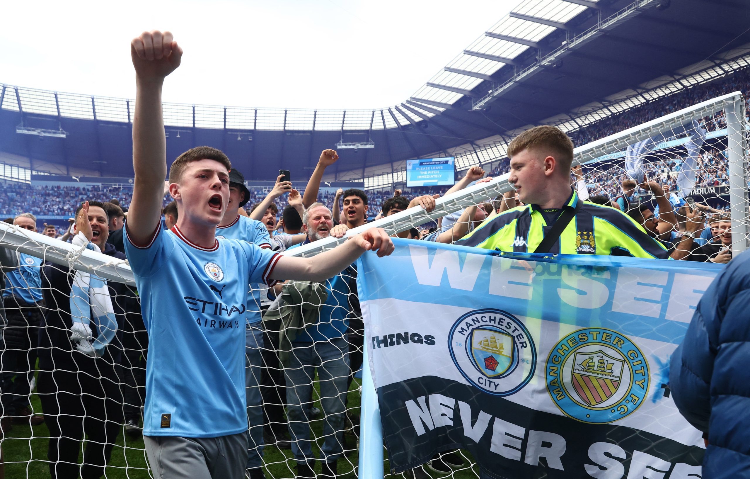 Soccer-Man City fight back to win title, Spurs take fourth