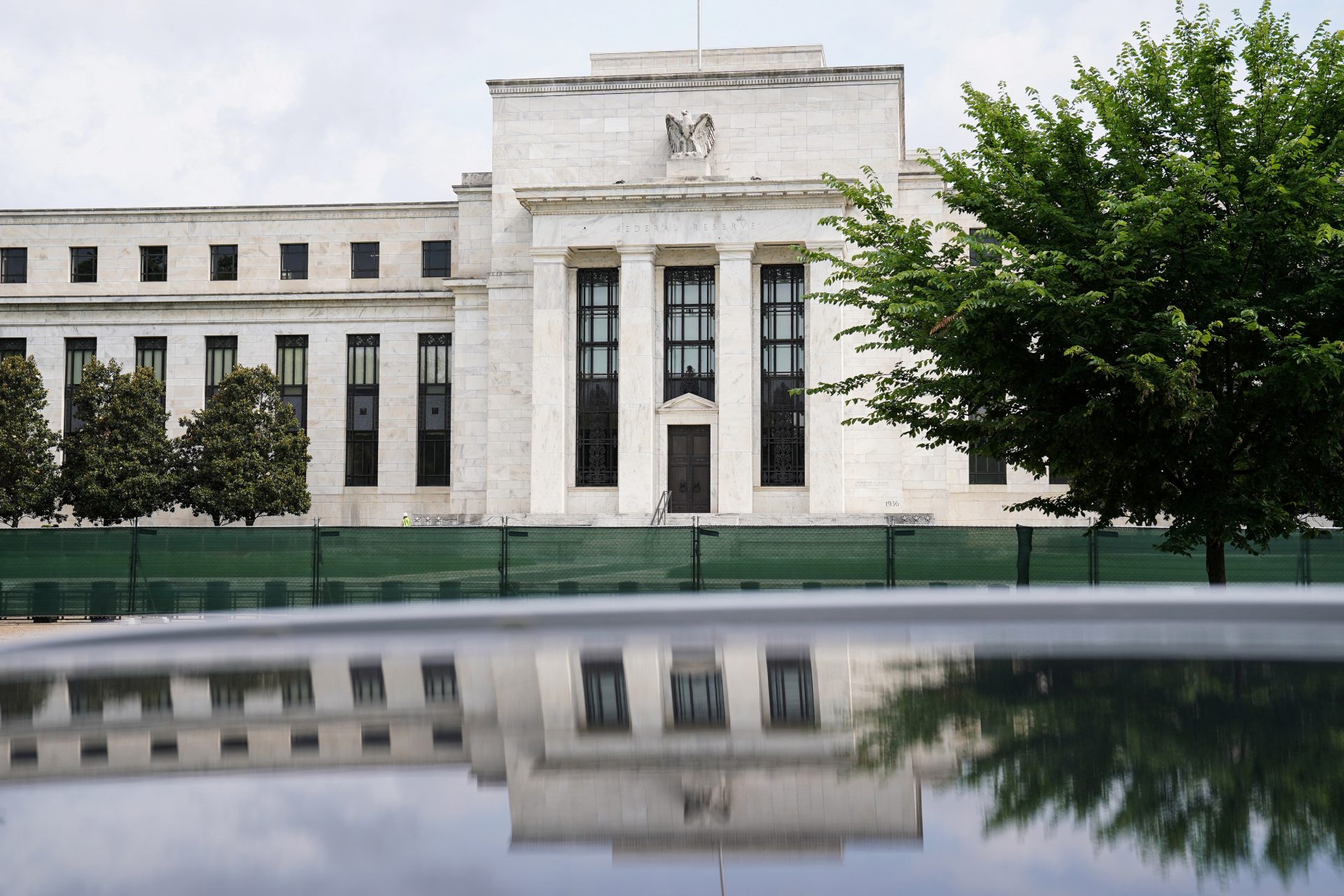 Fed unveils biggest rate hike since 1994, flags slowing economy