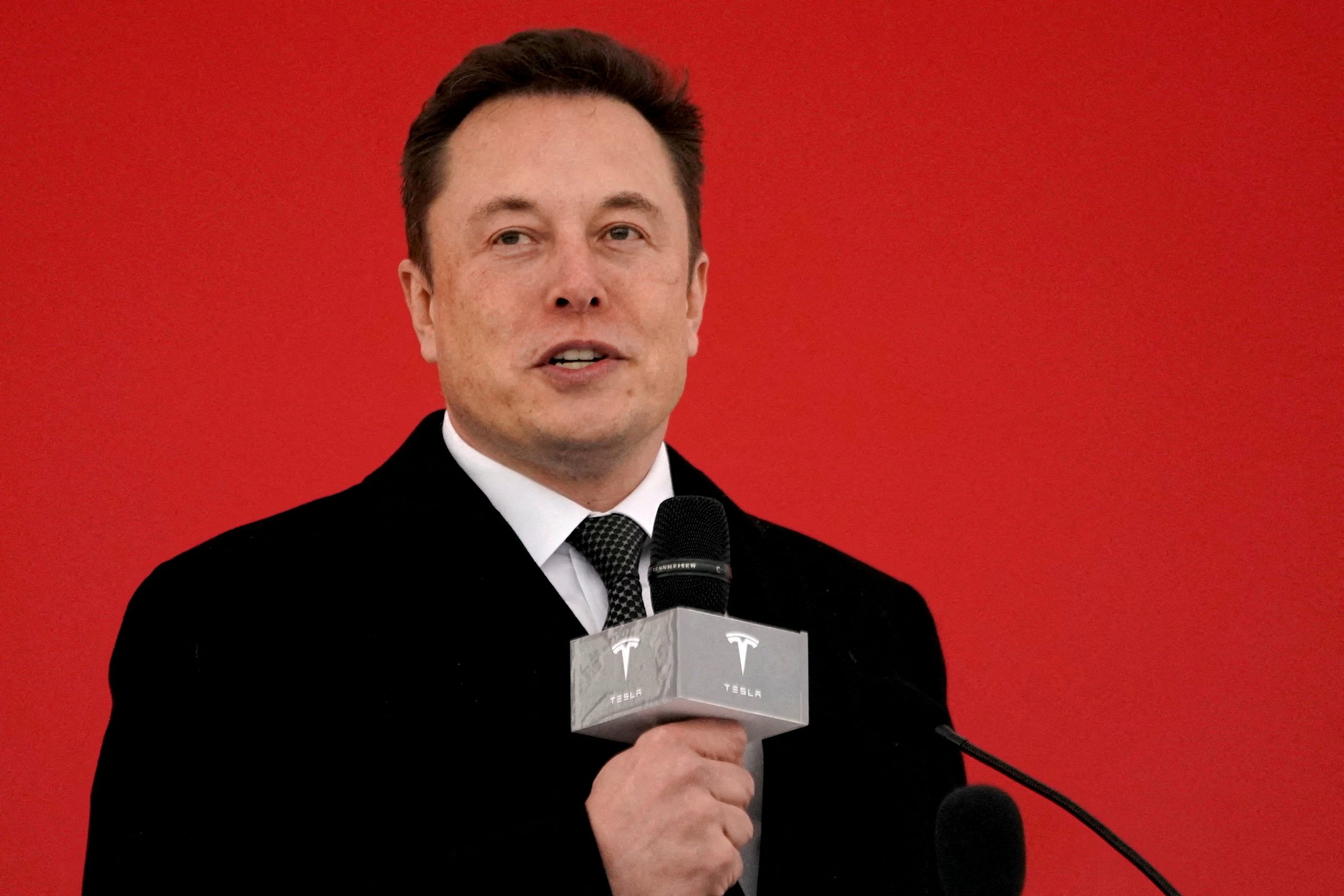 Tesla employee sues Musk, board