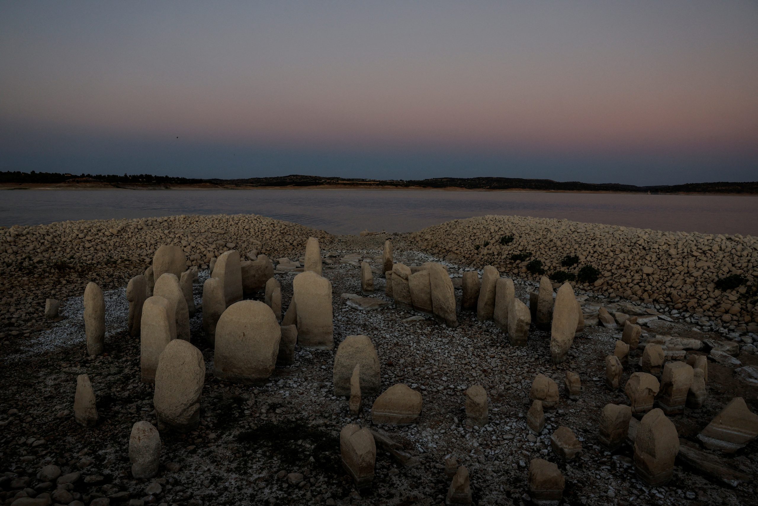 Europe’s drought exposes ancient stones, World War Two ships as waters fall