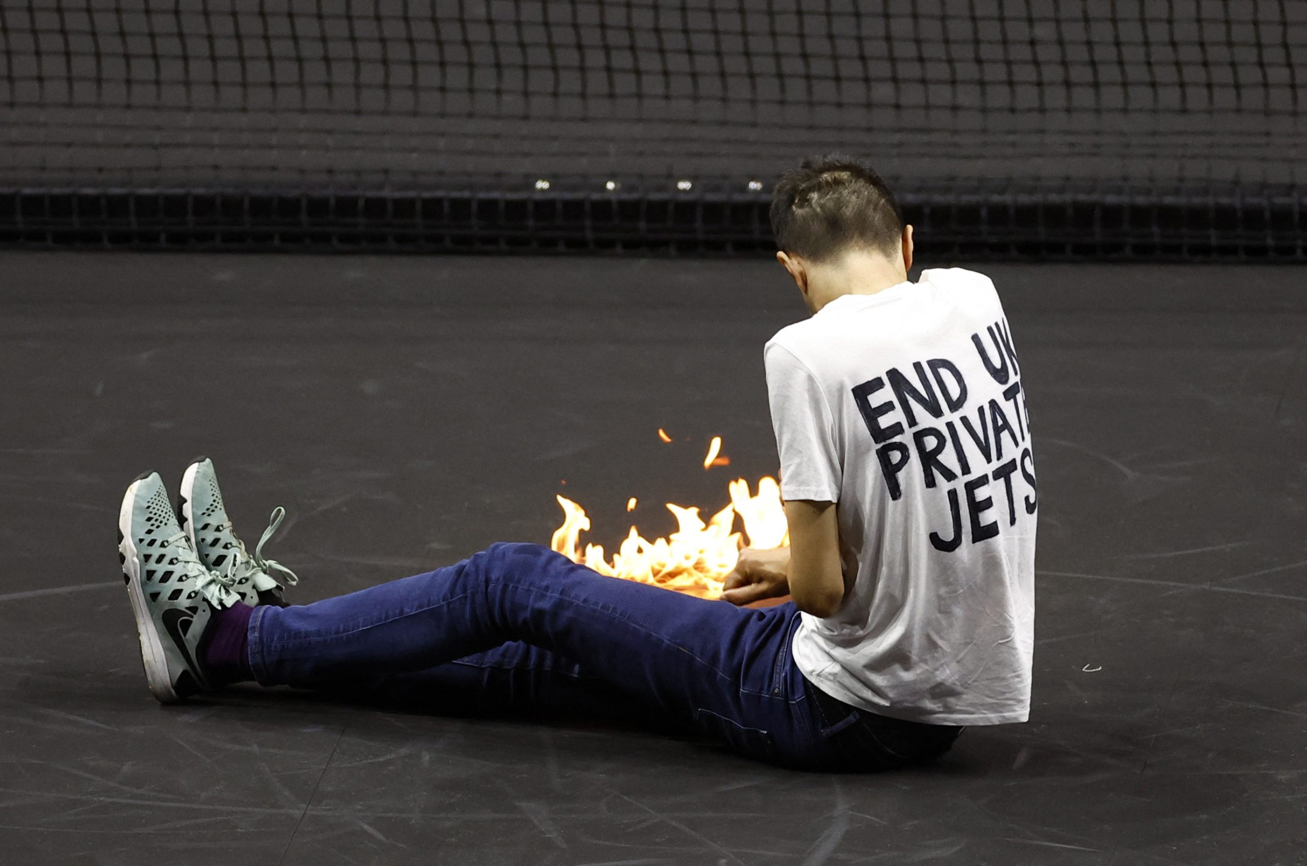 Climate protester sets arm on fire on tennis court at London’s Laver Cup