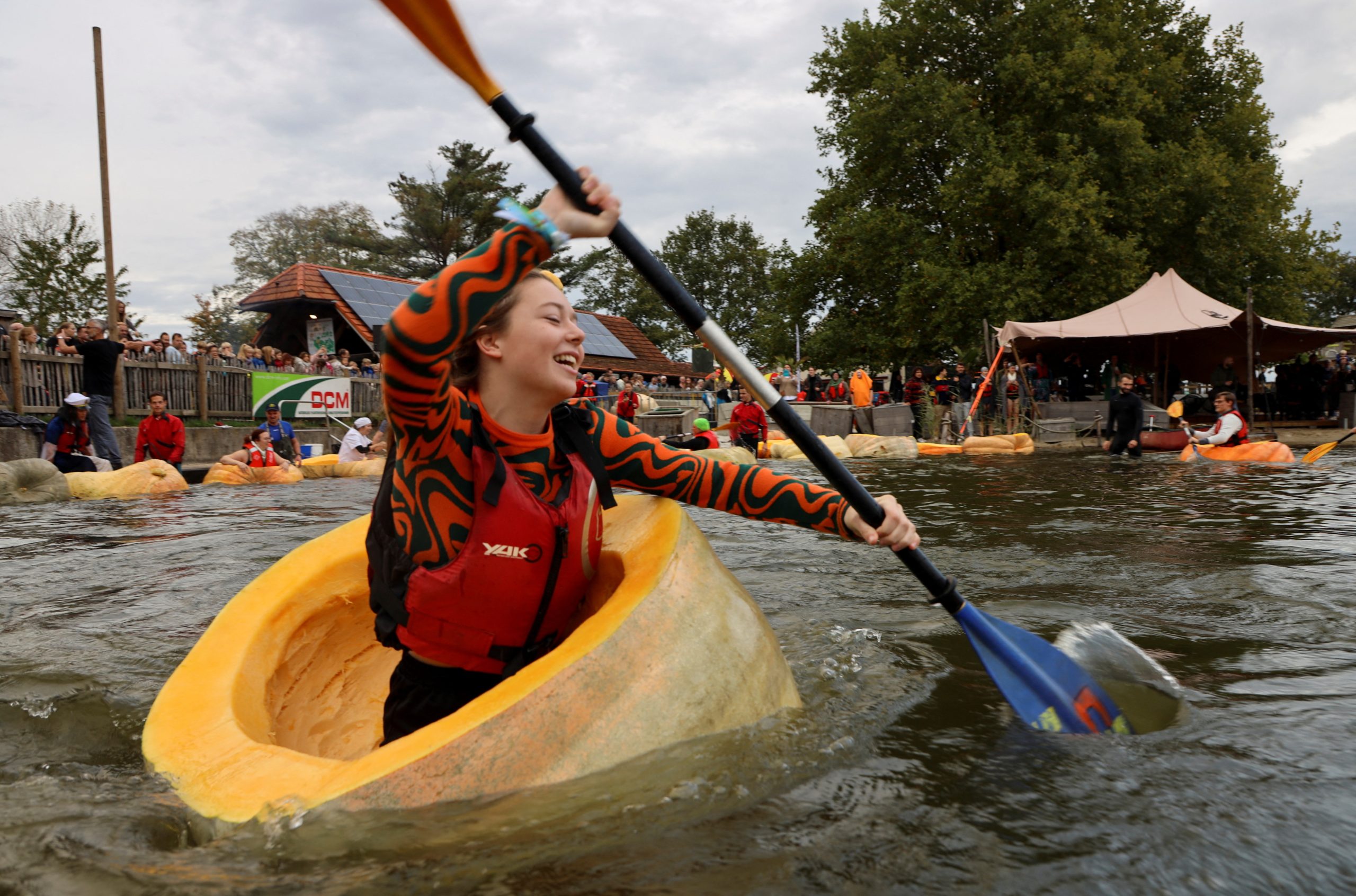 Paddle your own pumpkin: racers descend on Belgian pond