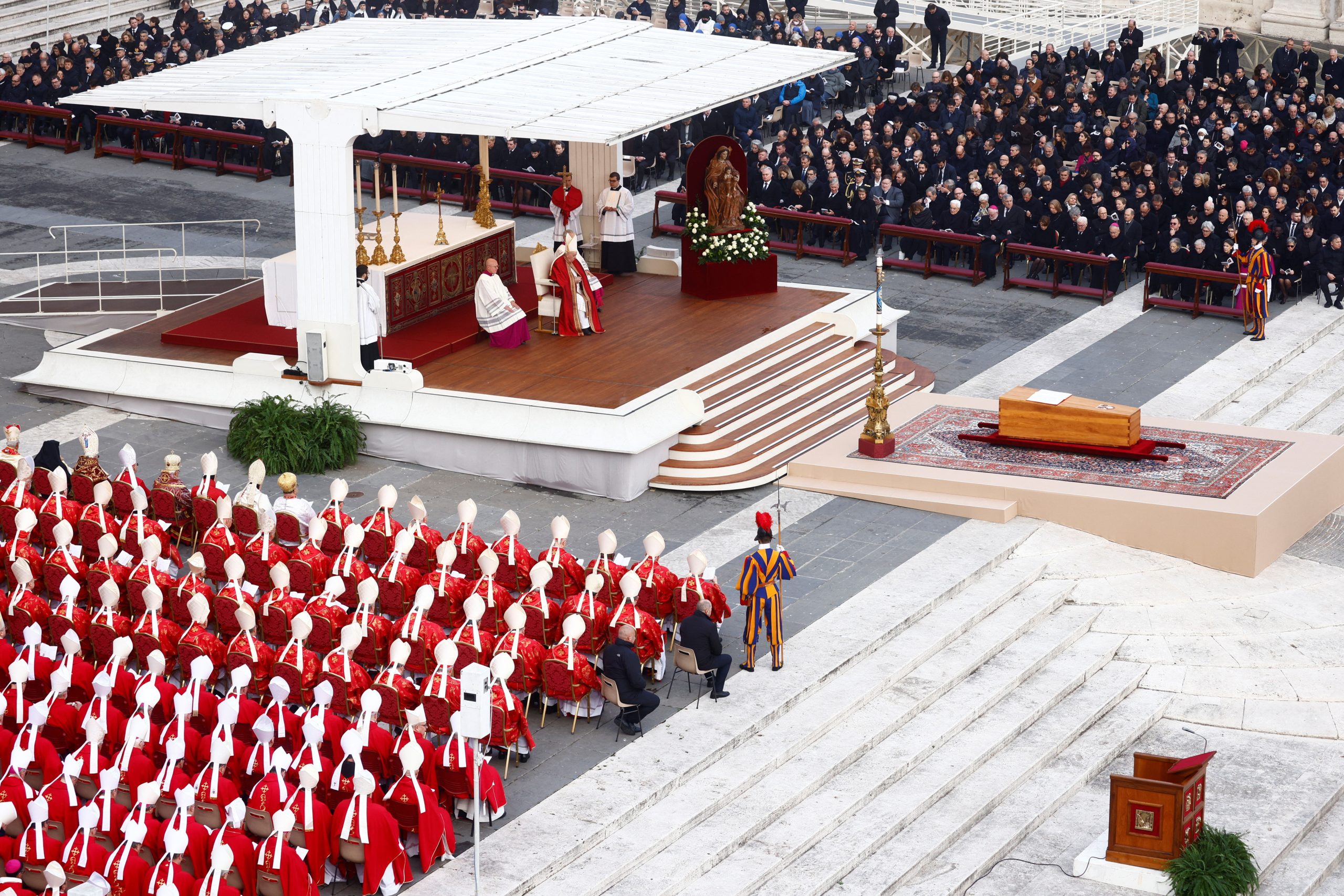 Supporters ask for sainthood for Benedict as Pope Francis leads funeral