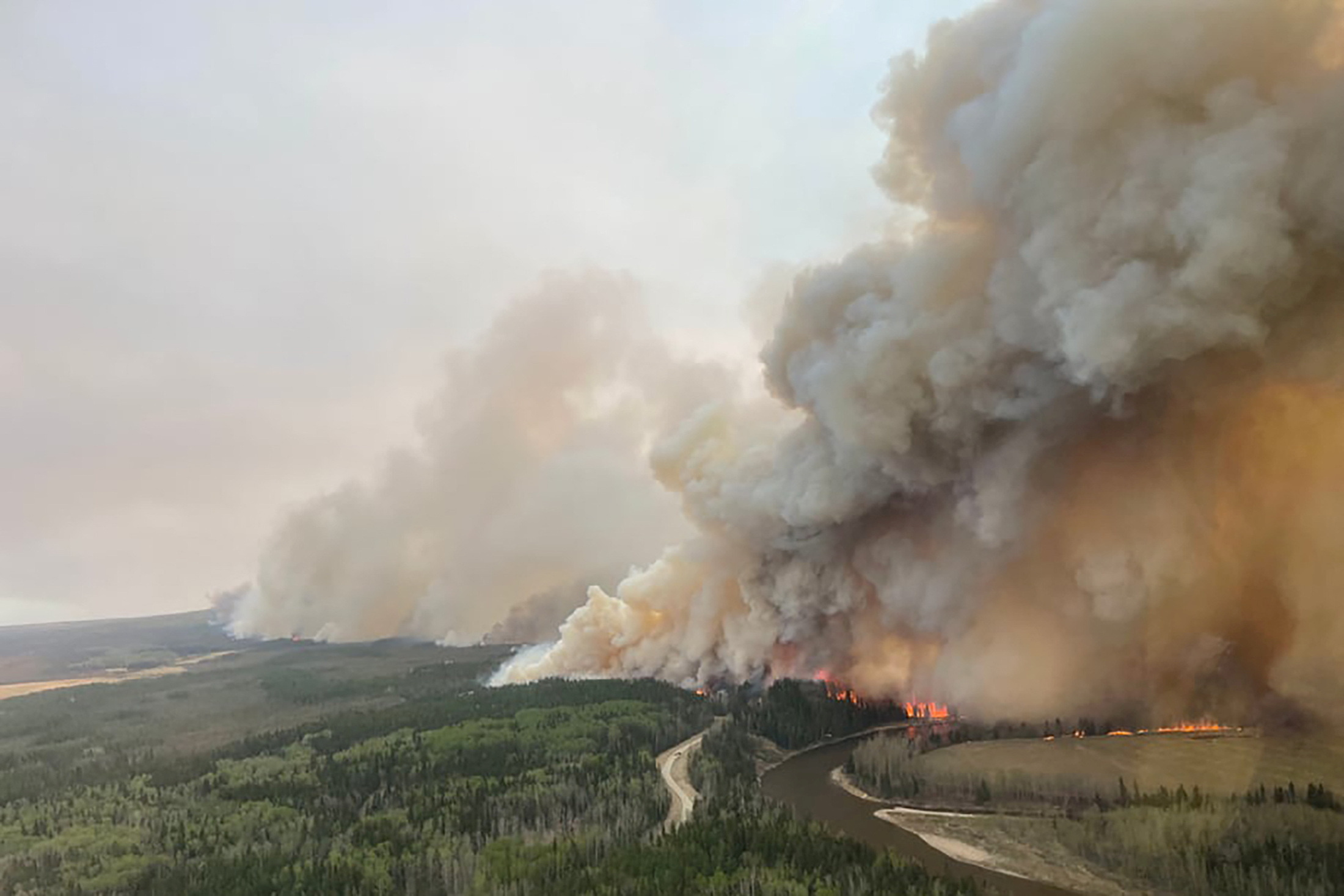 Alberta, Canada declares emergency, shutdowns oil production as 100-plus wildfires rage