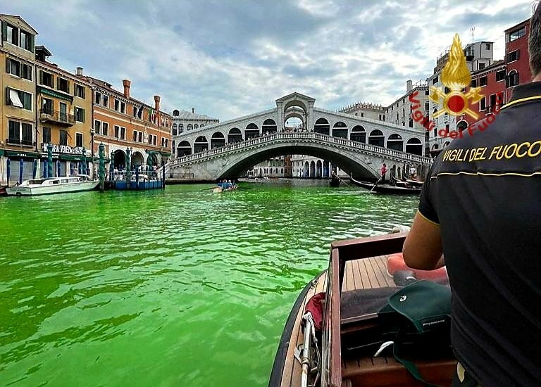 Venice’s Grand Canal turns bright green